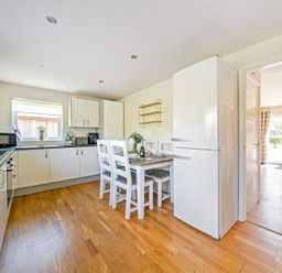 A kitchen with a dining table and chairs at Sage Lodge Near Brigg