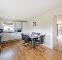 A kitchen with a dining table and chairs at Paddington Lodge near Brigg