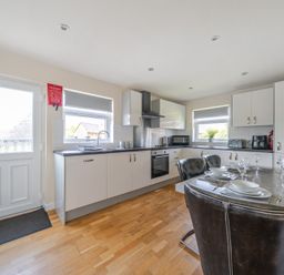 A kitchen with countertop and dining area at Paddington Lodge near Brigg