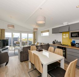 A kitchen with dining area and lounge space at Blencathra Family in Penrith