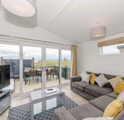 A living room with a sofa and coffee table at Blencathra Family in Penrith