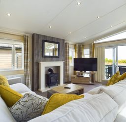 A living room with a sofa and TV at Keswick in Penrith