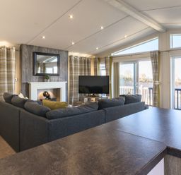 A living room with a television and sofa at Keswick (Pet) Penrith