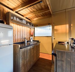 A kitchen with a fridge and sink at Savannah (Pet) Penrith