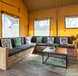 A living room with a sofa and coffee table at Kruger in Penrith