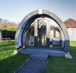 A pod structure with glass door and furniture at Pod 7 (Pet Friendly) Tewitfield