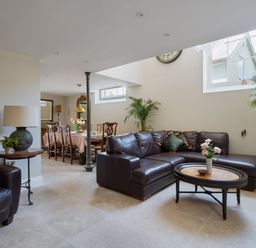 A living room with a sofa and table at The School House in Newton Abbot
