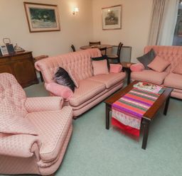 A living room with sofas and a coffee table at Grange Cottage in Belford