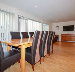 A dining room with a table and chairs at 65 Benasa Lodge near St Columb Major