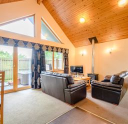 A living room with a sofa and coffee table at Muirloch Spa Plus in Dundee