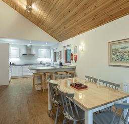 A kitchen with a dining table and chairs at Galbraith Premier Spa (Pet) Dundee