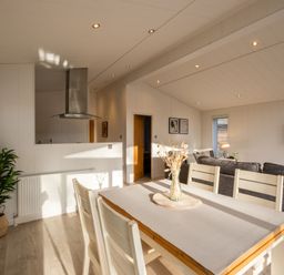 A dining room with a table and chairs at Belfry Waltham