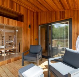 An outdoor lounge area with seating and a sauna at Moonlight Spa Luxury in Waltham