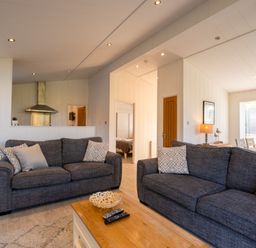 A living room with sofas and a dining area at Wentworth in Waltham