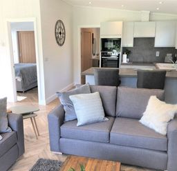 A living room with a sofa and coffee table at Dream View in Waltham