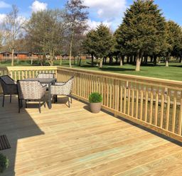 A deck with a table and chairs at Imperial View in Waltham