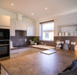 A kitchen with modern appliances and a sink at Imperial View in Waltham