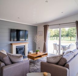 A living room with a television and coffee table at Imperial View in Waltham