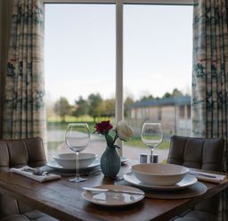 A dining room setup with table and chairs at The Henley in Waltham