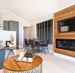 A living room with a sofa and television at Shangri-La in Waltham