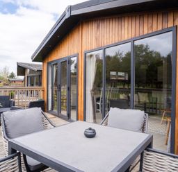 An outdoor seating area with a table and chairs at The View in Waltham
