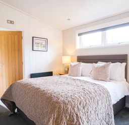 A bedroom with a bed and bedside tables at The Luxury Retreat in Waltham