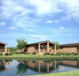 Log cabins near a pond at Luxury Boutique Retreat Spa in Waltham
