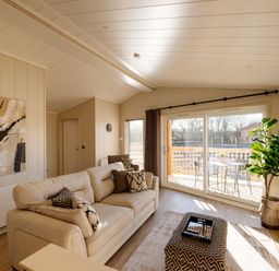 A living room with a sofa and sliding door at Luxury Boutique Retreat Spa Waltham