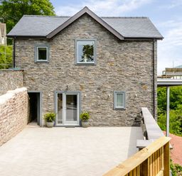 A house with a deck and garden area at The View in Laugharne