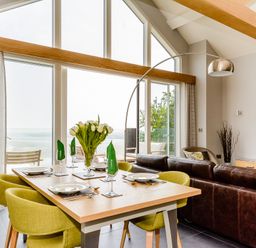 A dining room with a table and chairs at The View in Laugharne
