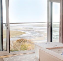A living room with a view of the landscape at Milk Wood 3 Spa Laugharne