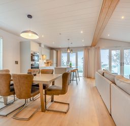 A dining area with table and chairs at Epic Spa (Roof Terrace) Laugharne