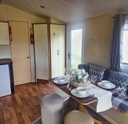 A dining area with table and chairs at Caravan 1 at Blackmoor Farm near Tenby