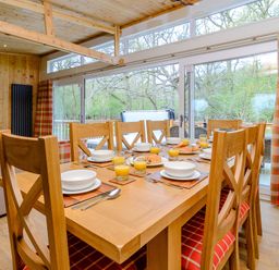 A dining room with a table set for breakfast at The Fotheringhay (Pet) in Kings Cliffe