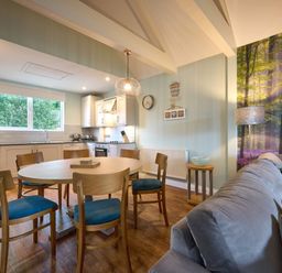 A kitchen with a dining table and chairs at The Whitbarrow Den in Penrith