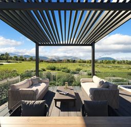 An outdoor patio with seating and a view at Fell Side in Penrith