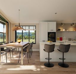 A kitchen with a dining table and bar stools at Fell Side in Penrith