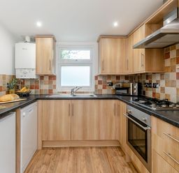 A kitchen with appliances and countertops at Droskyn Spa Pet Perranporth