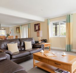 A living room with a sofa and table at The Allensford (Pet) Slaley