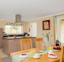 A kitchen with a dining table and breakfast items at The Allensford (Pet) in Slaley