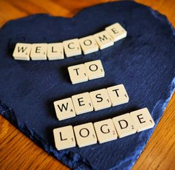 A welcome sign made of letters on a slate at West Lodge in Kirriemuir