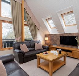 A living room with a sofa and coffee table at The Hexham in Slaley
