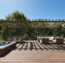 A garden with a hot tub and outdoor furniture at Heatherwood (Pet) in Slaley