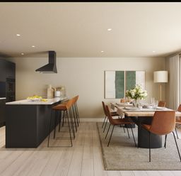 A kitchen with bar stools and a dining table at Heatherwood (Pet) in Slaley