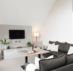 A living room with a sofa and coffee table at The Hexham Spa in Slaley