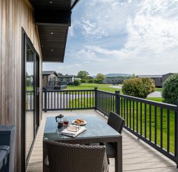 An outdoor patio with a table and chairs at Stokesley (Pet) Great Ayton
