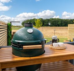 A Big Green Egg grill on an outdoor table at The Oasis in Great Ayton