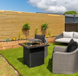 A seating area with a table and chairs at The Oasis in Great Ayton