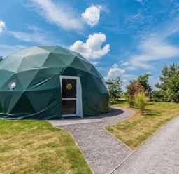 A dome structure with a door beside a pathway at The Dome in Great Ayton