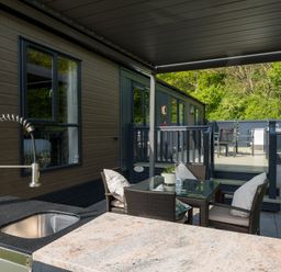 An outdoor area with a table and chairs at The Woods in Great Ayton